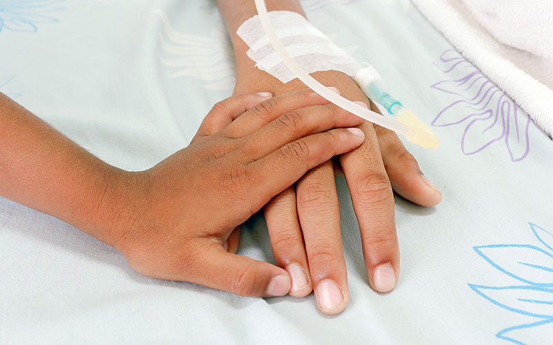 Child holding adult