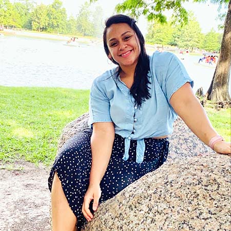 Nursing alumna Tania Lopez sitting outside